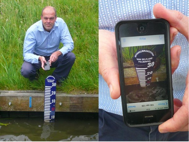 Figure 5: Dr. Peter-Jules van Overloop taking a picture of a water gauge with water level readings.