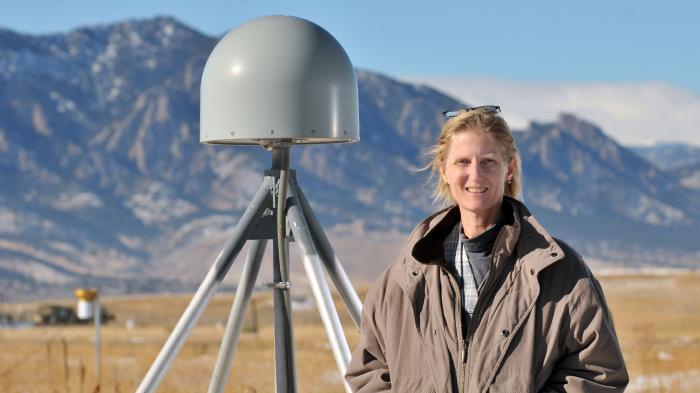 Dr. Kristine M. Larson in front of her favorite GPS site (P041) near Boulder, Colorado. The gray object next to Dr. Larson is a GPS receiver antenna. Photograph by Glenn Asakawa, University of Colorado. Dr. Kristine M. Larson, Professor of Aerospace Engineering Sciences, University of Colorado, Boulder, CO Research interests: Plate tectonics and geodesy, with work developing new ways of using the Global Positioning System (GPS) to study Earth and the water cycle. Research highlights: For many, GPS is a 