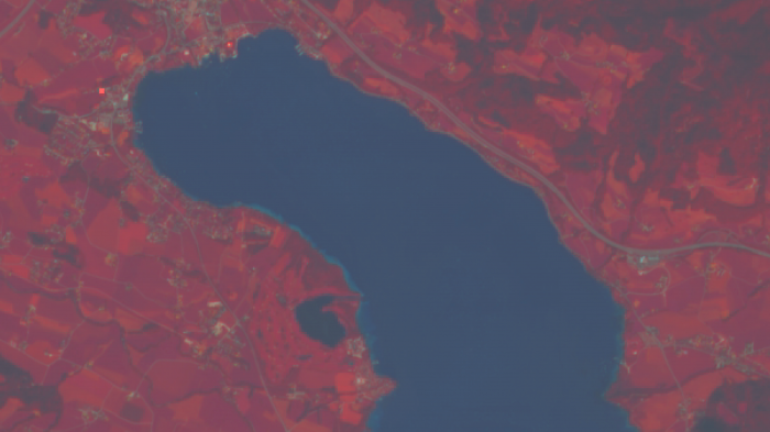 Sentinel-2 false-colour image of Lake Mondsee in Austria. The lake appears deep blue whereas the surrounding vegetated areas are coloured red due to the strong reflection of sunlight in the infra-red portion of the electro-magnetic spectrum